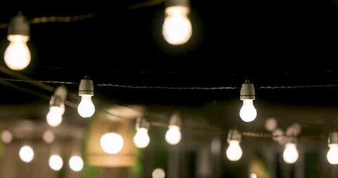 Outdoor party string lights glowing at night Stock Footage 115162672