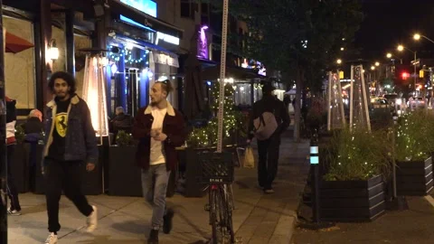 Outdoor patio heaters as cold weather arrives in COVID 19 pandemic Stock Footage 140883353