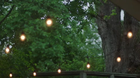Outdoor patio string lights twinkle and fade out Stock Footage 251226172
