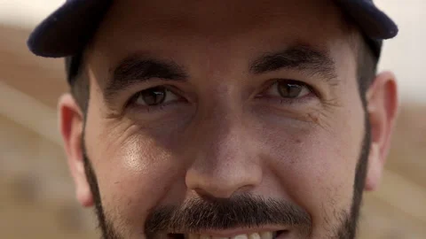 Outdoor portrait of a Hispanic man looking at the camera smiling. Close-up of a Stock Footage 157412984