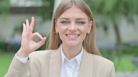 Outdoor Portrait of Thumbs Down Gesture by Young Businesswoman Stock Footage 156971058