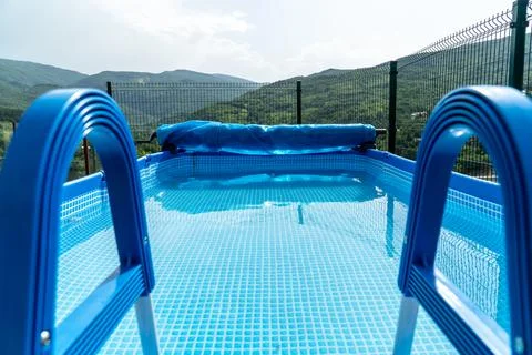 Outdoor protable pool with a mountain view Stock Photos