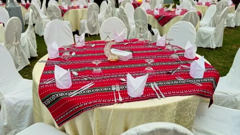 Outdoor Ramadan event table setup with crescent centerpiece and traditional Video stock 329478002