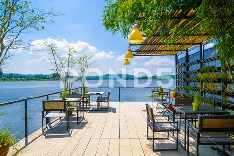 Outdoor restaurant with beautiful view on Lake. Stock Photos