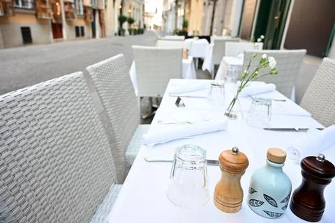 Outdoor Restaurant Dining Table With Elegant Table Setting Stock Photos