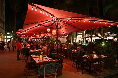 Outdoor restaurant on Lincoln Road Mall in Miami Beach, Florida at night. Stock Photos