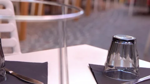 Outdoor Restaurant Table Setting with Glassware and Napkin in Cassis Stock Footage 337925861