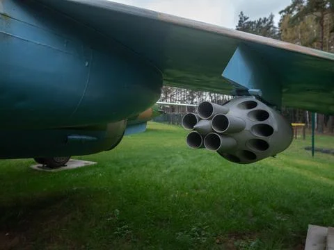 Outdoor rocket launcher display analysis, weathered rocket pod cluster with Stock Photos