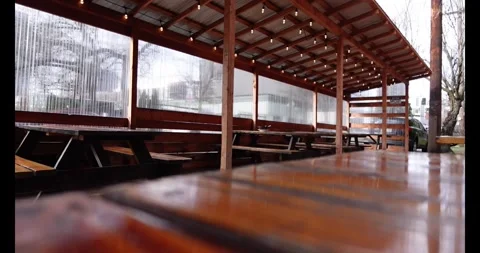 Outdoor seating of a restaurant in a cold winter day Видео 303256544