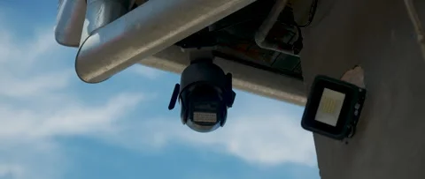 Outdoor security camera and surveillance system mounted under an eave, moni.. Video stock 337022929