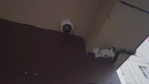 Outdoor Security Camera on a Brick Wall of a House. CCTV camera Stock Footage 208590948