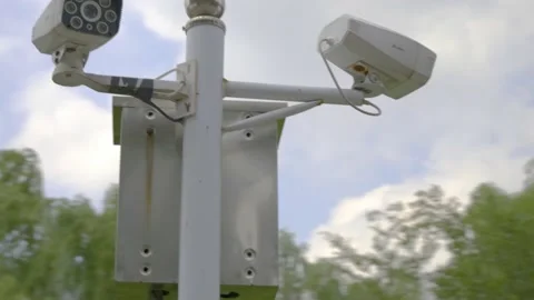 Outdoor security surveillance camera under blue sky Stock Footage 157532377