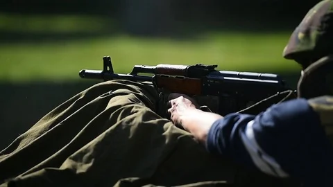 Outdoor shooting with automatic rifle in a shooting range Видео 82426408