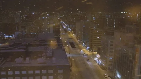 Outdoor snow viewed inside an elevator ride in Sapporo, Japan Stock Footage 151462700