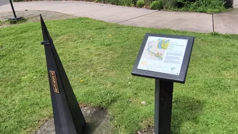 Outdoor Solar System Trail sign displays a map and Venus marker Stock Footage 342363664