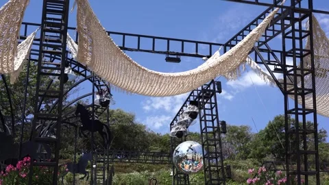 Outdoor stage setup features hanging macrame fabric 스톡 동영상 315443557