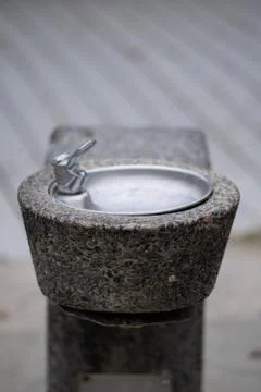 Outdoor Stone and Metal Water Drinking Fountain Stock Photos
