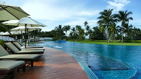 Outdoor swimming pool in hotel resort Stock Footage