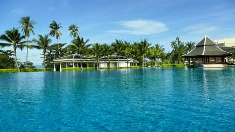 Outdoor swimming pool in hotel resort Stock Footage