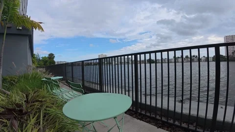 Outdoor table and chairs by a river view Stock Footage 320221415
