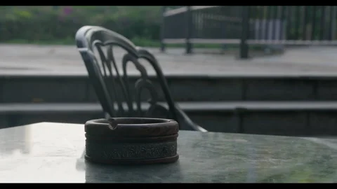 Outdoor Table with Ashtray in Public Space for Mindfulness Background Use Stock Footage 328097017