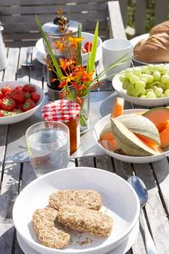 Outdoor table set for breakfast Stock Photos