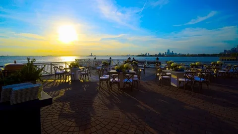 OUTDOOR TABLE SETUP BY THE WATER IN BROOKLYN Stock Footage