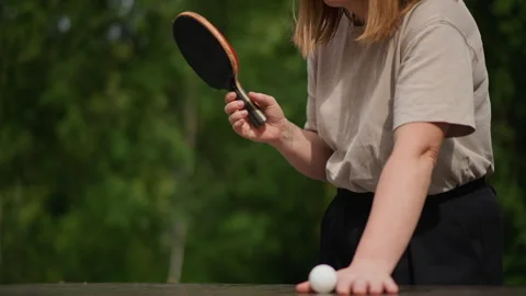Outdoor Table Tennis Practice Session, Closeup Of Woman Serving Ping Pong Ball Stock Footage 324816703