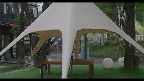 Outdoor Tent with String Lights and Table for Mindfulness Background Use Stock Footage 328230637