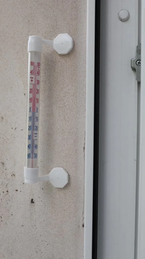 Outdoor thermometer by window Stock Footage 336927672