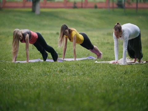 Outdoor training in the park - yoga at morning Stock Footage