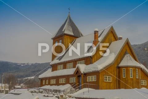 Outdoor view of the Stave Church partial covered with snow during a heavy winter Stock Photos