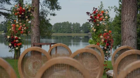 Outdoor Wedding Ceremony Setup by a Tranquil Lakeside 스톡 동영상 331016741