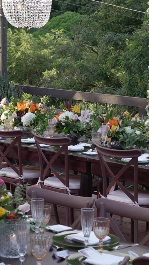 Outdoor Wedding Reception Table Setting with Floral Centerpieces, Garden Venue 스톡 동영상 344985579