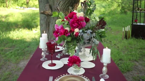 Outdoor Wedding table decorations on a sunny day steadicam Stock Footage 50978732