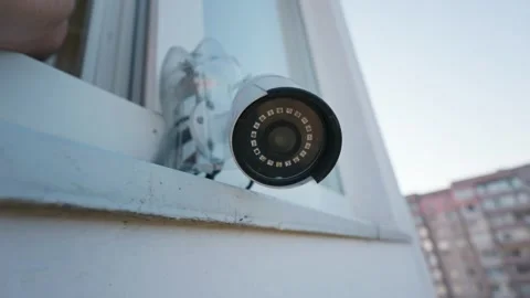 Outdoor White Cctv Security System Installed on Exterior Window Ledge Stock Footage 338101219