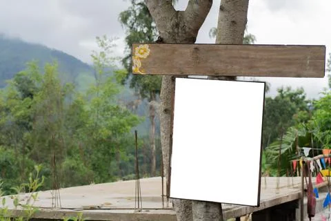 Outdoor white sign and rectangular wooden sign with natural background. Stock Photos