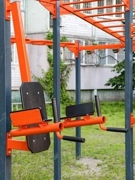 Outdoor workout complex with fixed exercise equipment in a public residenti.. Stock Photos