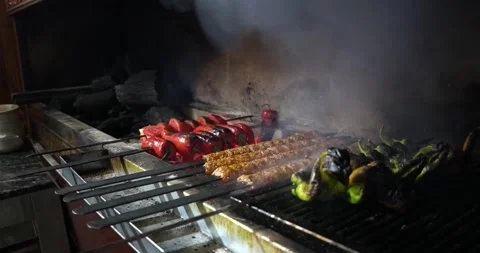 Outdoors summer grilling barbecue backyard roasted delicious foods Stock Footage 336576224