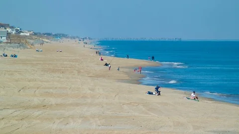 Outer Banks Visitors on Nags Head Beach in North Carolina Stock Footage 73027365