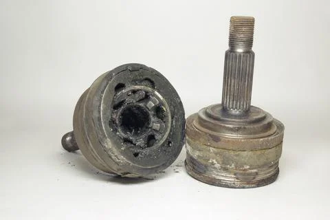 Outer CV joints pair, dismantled from car for change. worn out. metal axle .. Stock Photos