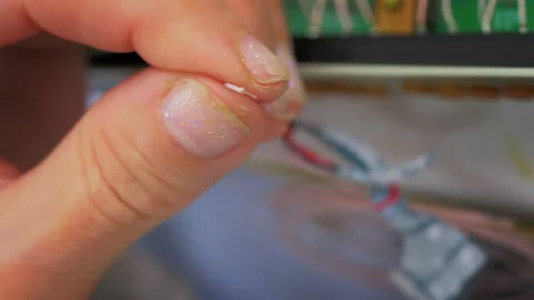 Outer Layer of Cable is removed.Soldering the Wire.Folding the Edge with tweezer Stock Footage 172567908