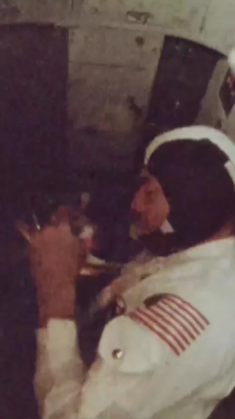 OUTER SPACE - 1968 - Astronaut Bill Anders uses a flashlight in zero gravity Stock Footage 342645370