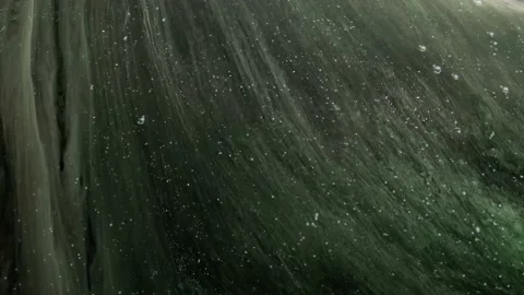 A Outer space view of gassy green planet surrounded by stars Stock Footage 155221567