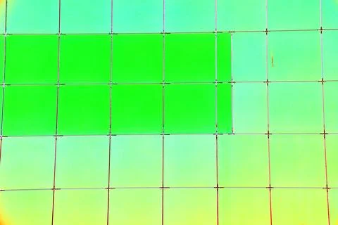 The outer wall of the building is finished with framed plastic tiles, the c.. Ilustración de archivo