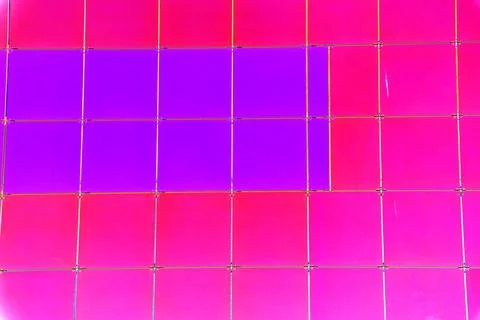 The outer wall of the building is finished with framed plastic tiles, the c.. Ilustración de archivo