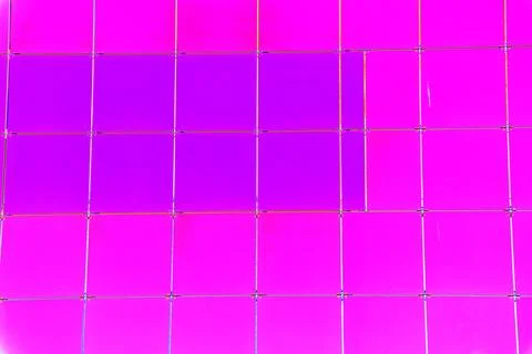 The outer wall of the building is finished with framed plastic tiles, the c.. Ilustración de archivo