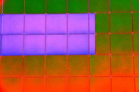 The outer wall of the building is finished with framed plastic tiles, the c.. Ilustración de archivo