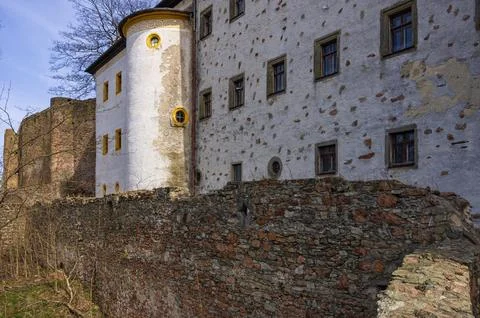 Outer wall of the castle ruins and facade of the castle today housing the Stock Photos
