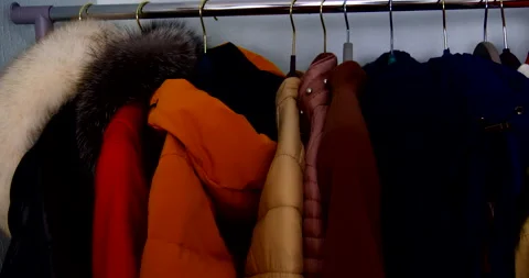 Outerwear on a hanger jacket coat close-up video 4k Stock Footage 143125040